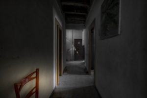 Interior of an apartment with abandoned walls, ceilings and floors in the center of a European city Interior of an apartment with abandoned walls, ceilings and floors in the center of a European city